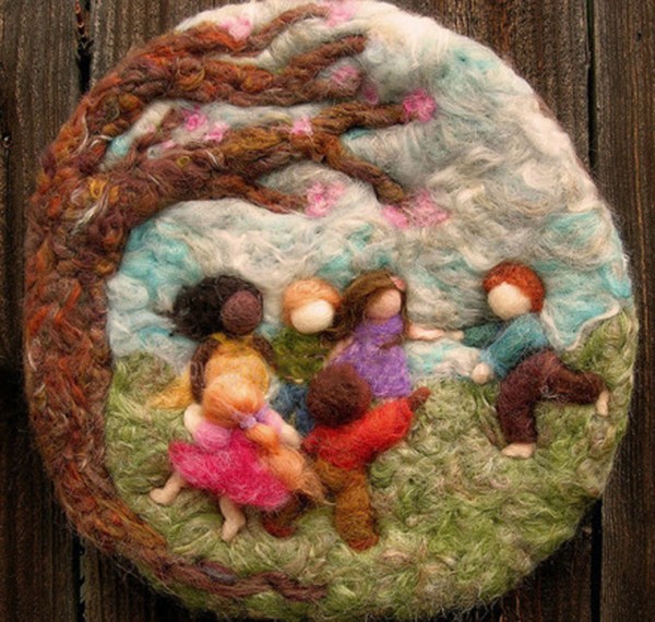 Children playing happily under the wool felt DIY tree