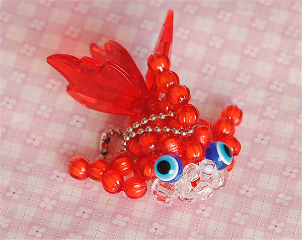 Small goldfish in various colors made by creative hand-beaded DIY