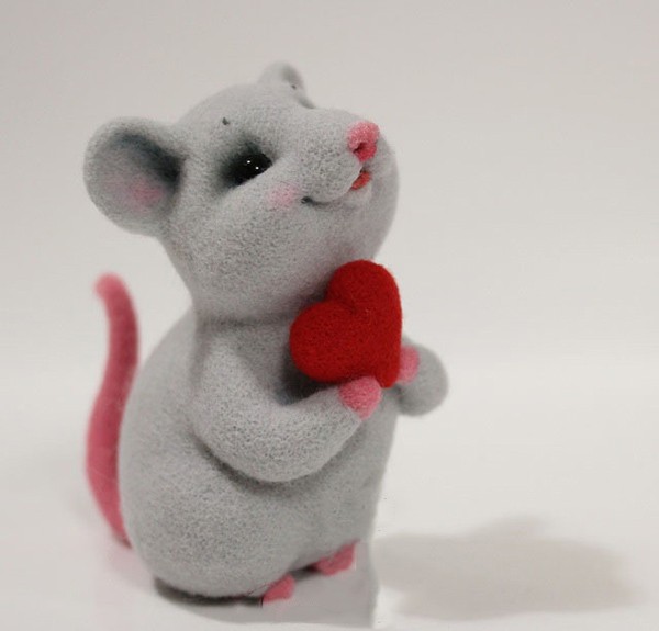 Cute wool felt handmade DIY little mouse holding a heart