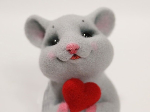 Cute wool felt handmade DIY little mouse holding a heart