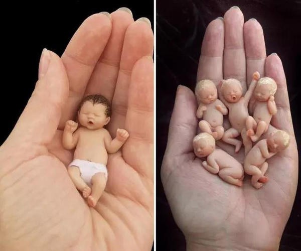 The cute sculpture Baby in the palm of your hand