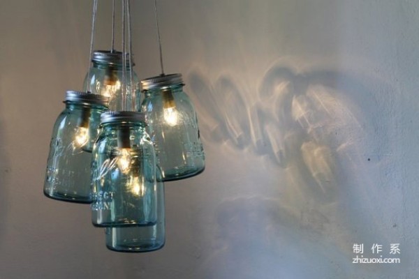 Using waste glass jars to create romantic Christmas lamps