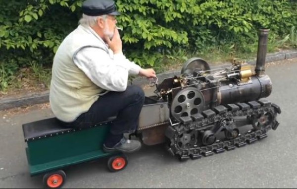 An old engineer builds a toy steam train that can add coal while running