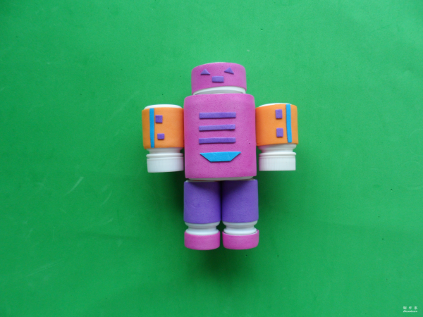 Isn’t this little robot cute? Cute childrens toy robot made from discarded pill bottles and colorful sponge paper