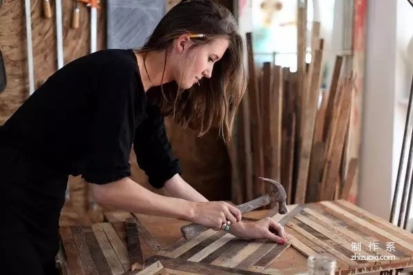 She is the most beautiful carpenter, turning piles of scrap wood into hot works of art