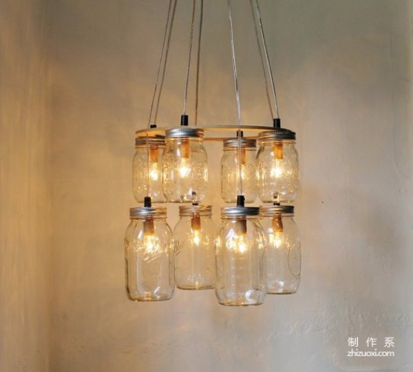 Using waste glass jars to create romantic Christmas lamps