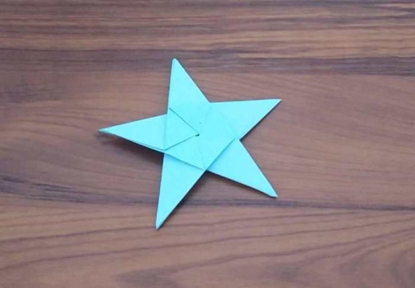 Fun origami for children. Teach children to fold a simple five-pointed star.