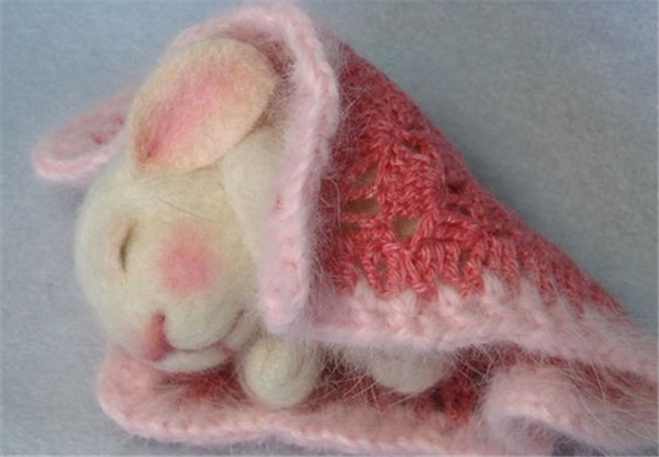 Adorable sleeping bunny made of handmade wool felt