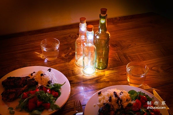 Cork caps that turn empty bottles into practical desk lamps