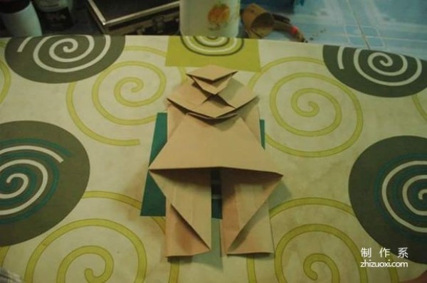 This is an origami illustration tutorial of Maitreya Buddha with a big belly and a big smile.