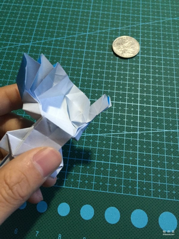 Real-life tutorial on origami Chirulian with complex origami cartoon characters