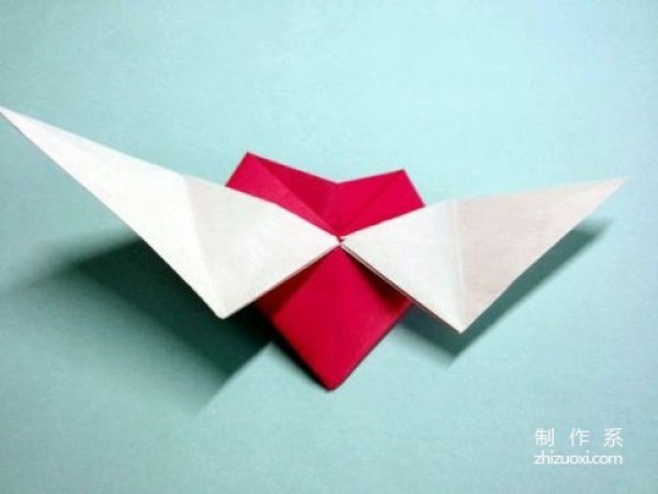 Tutorial on how to make handmade origami hearts with wings