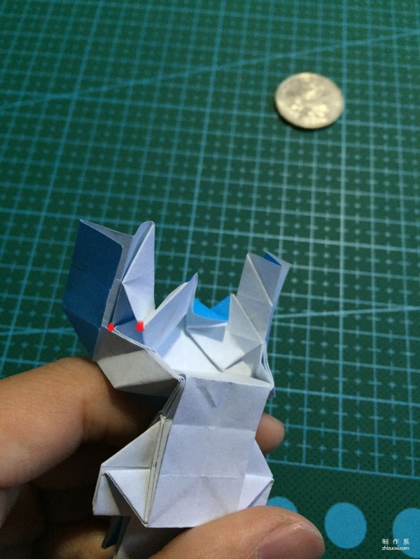 Real-life tutorial on origami Chirulian with complex origami cartoon characters