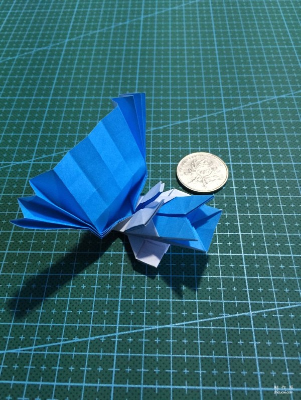 Real-life tutorial on origami Chirulian with complex origami cartoon characters