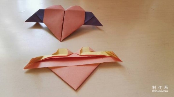 A handmade origami heart with wings - tutorial on how to make origami hearts