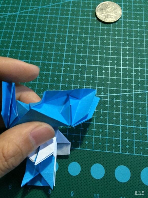 Real-life tutorial on origami Chirulian with complex origami cartoon characters