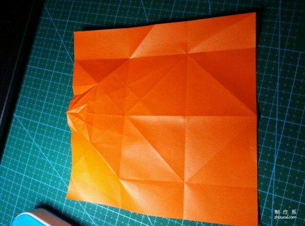 Origami method of folding a paper bird, real-life tutorial on origami of a small kingfisher