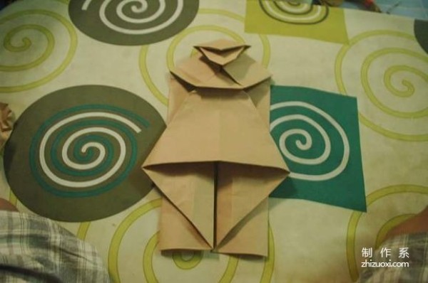 This is an origami illustration tutorial of Maitreya Buddha with a big belly and a big smile.