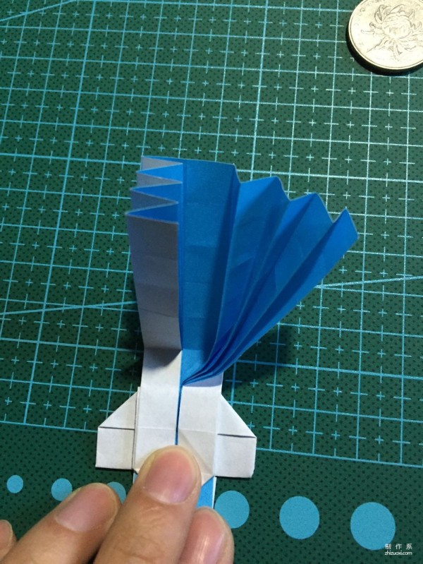 Real-life tutorial on origami Chirulian with complex origami cartoon characters