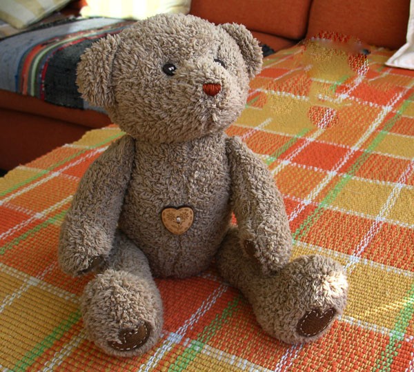 Cute brown plush teddy bear made from handmade DIY fabric