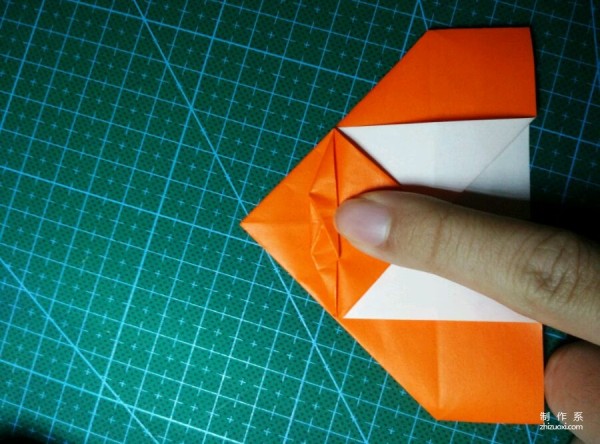 Origami method of folding a paper bird, real-life tutorial on origami of a small kingfisher