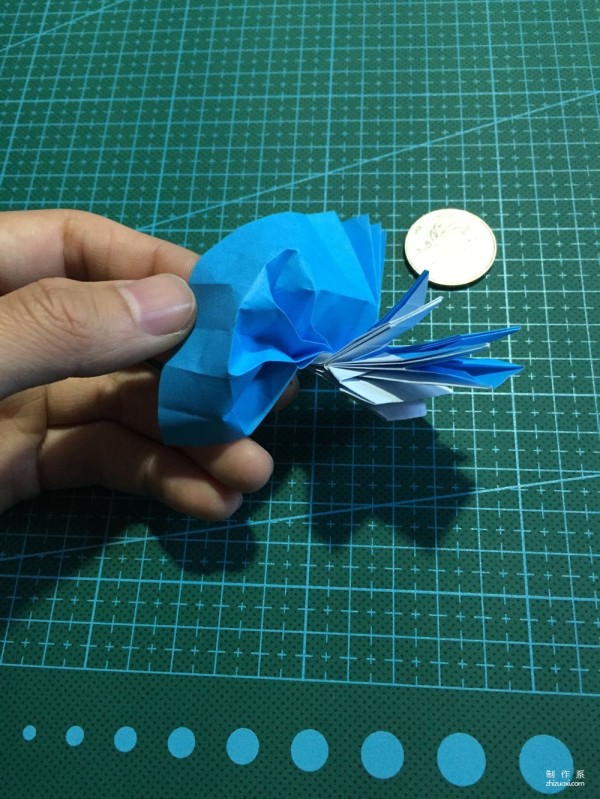 Real-life tutorial on origami Chirulian with complex origami cartoon characters