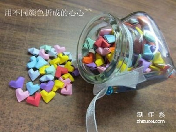 Illustrated tutorial on how to fold paper hearts with little stars in a wishing bottle