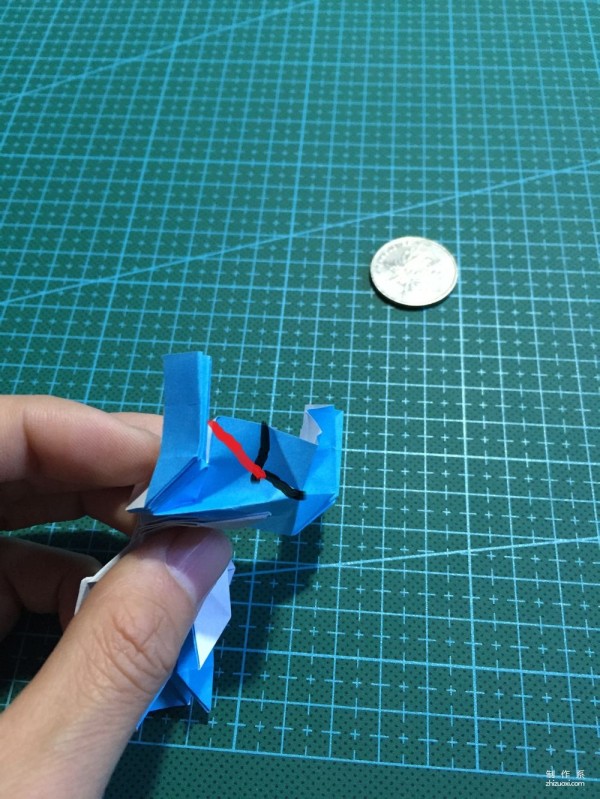 Real-life tutorial on origami Chirulian with complex origami cartoon characters