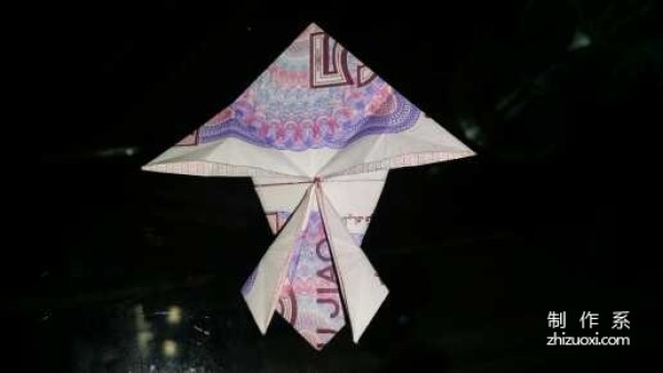 Tutorial on how to fold the little frog using five cents RMB