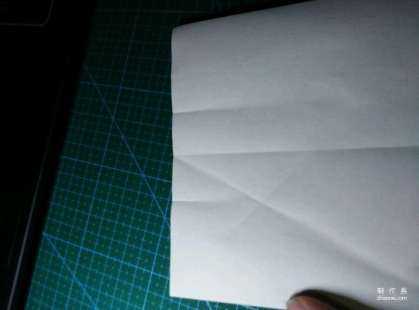 Origami method of folding a paper bird, real-life tutorial on origami of a small kingfisher