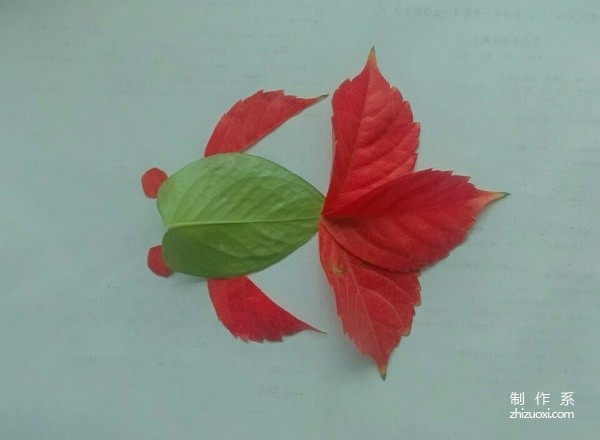 A handmade tutorial for leaf stickers with red tailed fish