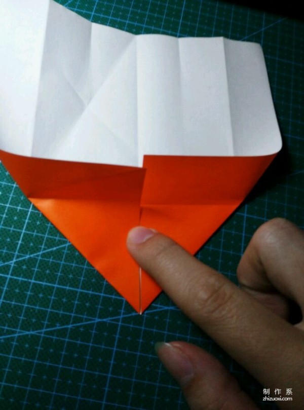 Origami method of folding a paper bird, real-life tutorial on origami of a small kingfisher