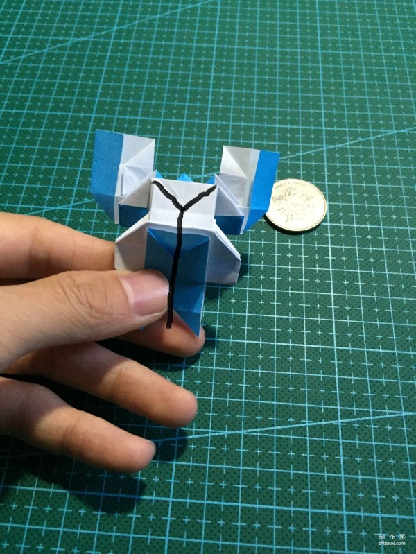 Real-life tutorial on origami Chirulian with complex origami cartoon characters