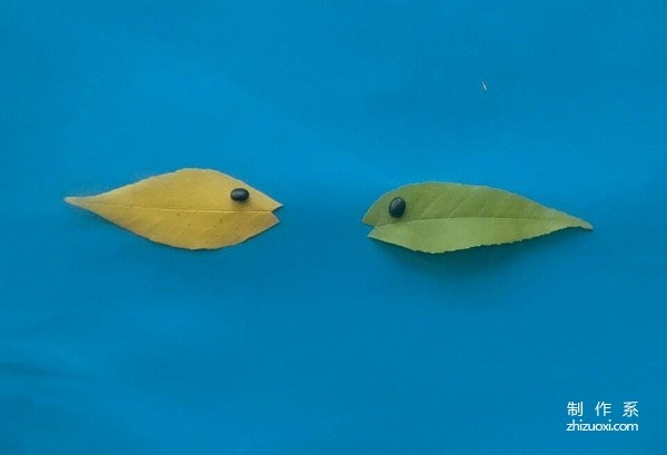 Handmade tutorial on leaf stickers of a pair of fish talking heart-to-heart