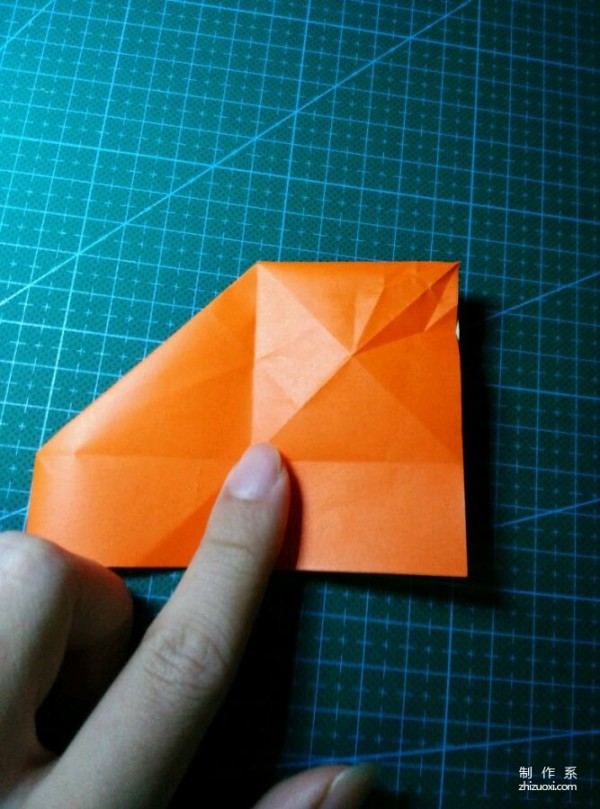 Origami method of folding a paper bird, real-life tutorial on origami of a small kingfisher