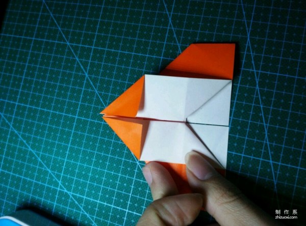 Origami method of folding a paper bird, real-life tutorial on origami of a small kingfisher