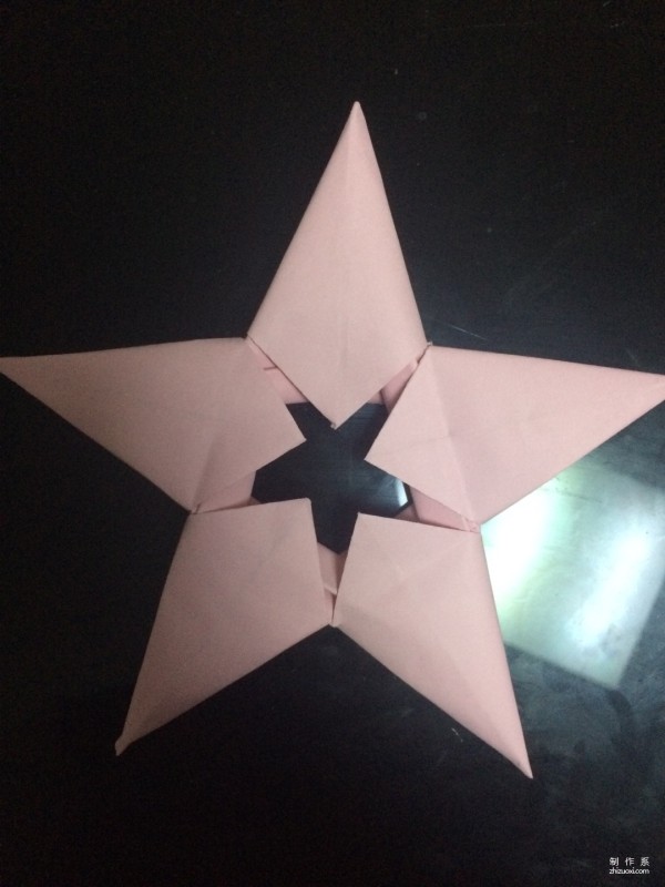 Very simple origami illustration of colored paper five-pointed star