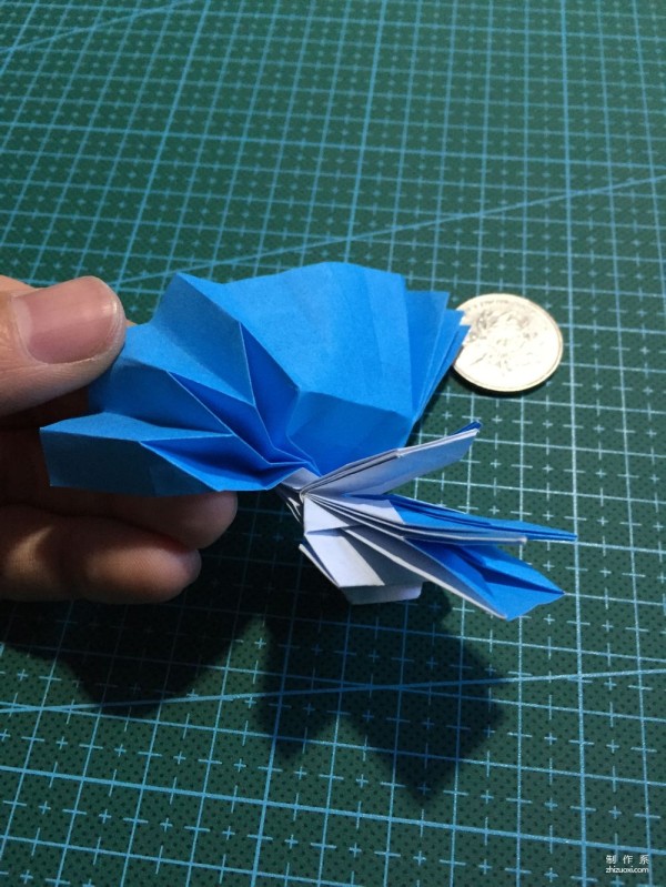 Real-life tutorial on origami Chirulian with complex origami cartoon characters