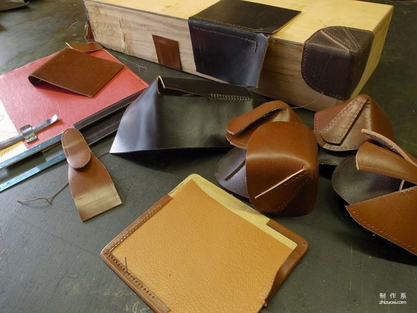 The process of Japanese craftsman Yukihiro Fujii making a leather suitcase based on a wooden box frame