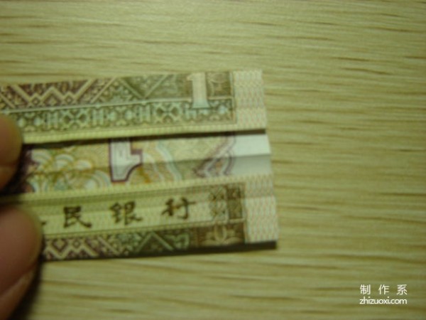 Illustrated tutorial for DIY handmade origami camera toys using RMB or US dollar banknotes