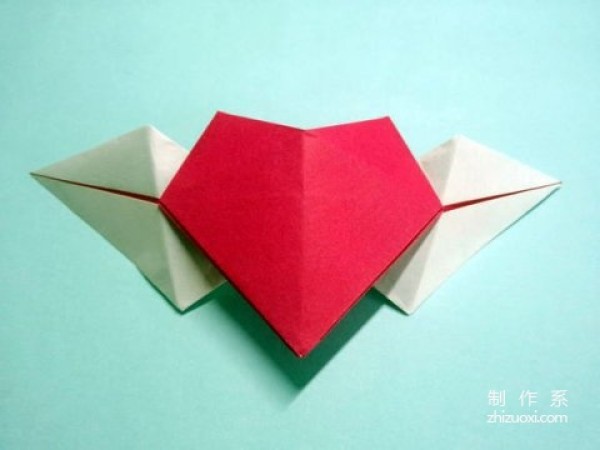 Tutorial on how to make handmade origami hearts with wings