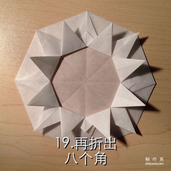 Illustrated step-by-step tutorial on geometric flower origami that can fold out layers of petals