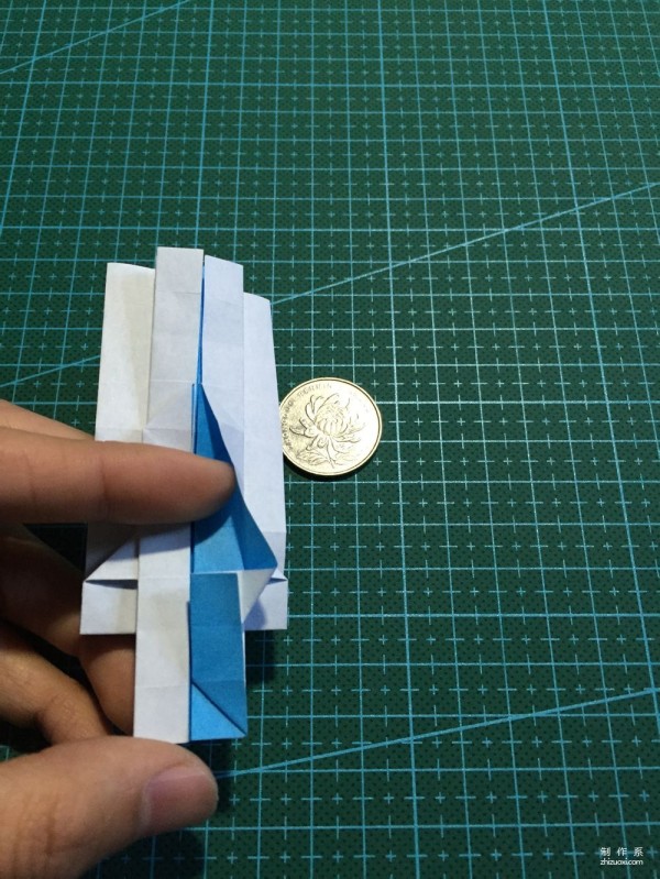 Real-life tutorial on origami Chirulian with complex origami cartoon characters