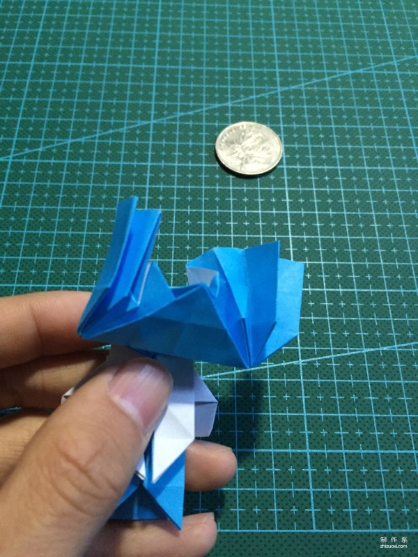 Real-life tutorial on origami Chirulian with complex origami cartoon characters