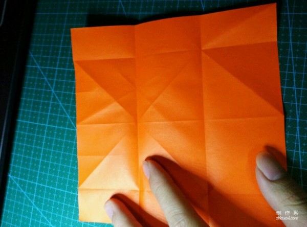 Origami method of folding a paper bird, real-life tutorial on origami of a small kingfisher