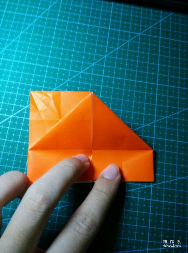 Origami method of folding a paper bird, real-life tutorial on origami of a small kingfisher