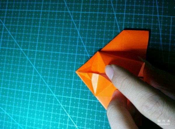 Origami method of folding a paper bird, real-life tutorial on origami of a small kingfisher