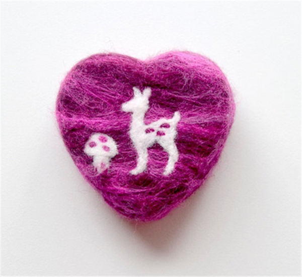 Cute heart-shaped handmade soap wrapped in wool felt