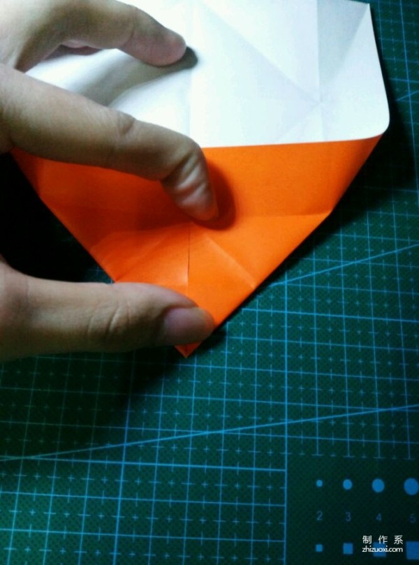 Origami method of folding a paper bird, real-life tutorial on origami of a small kingfisher