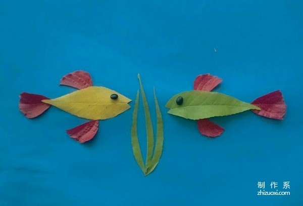 Handmade tutorial on leaf stickers of a pair of fish talking heart-to-heart